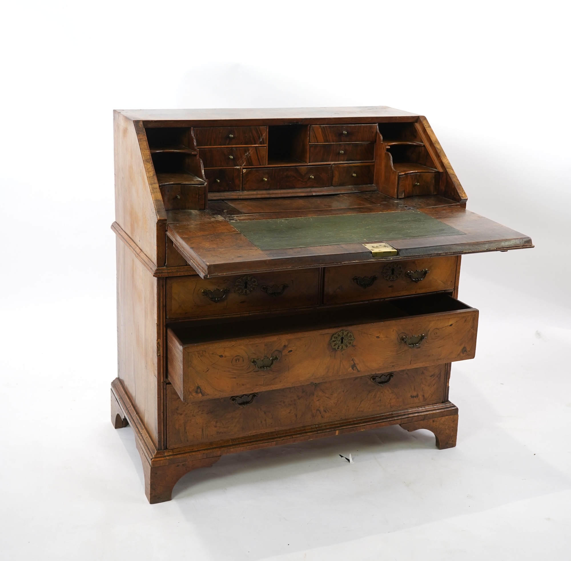 A George I feather banded walnut bureau
